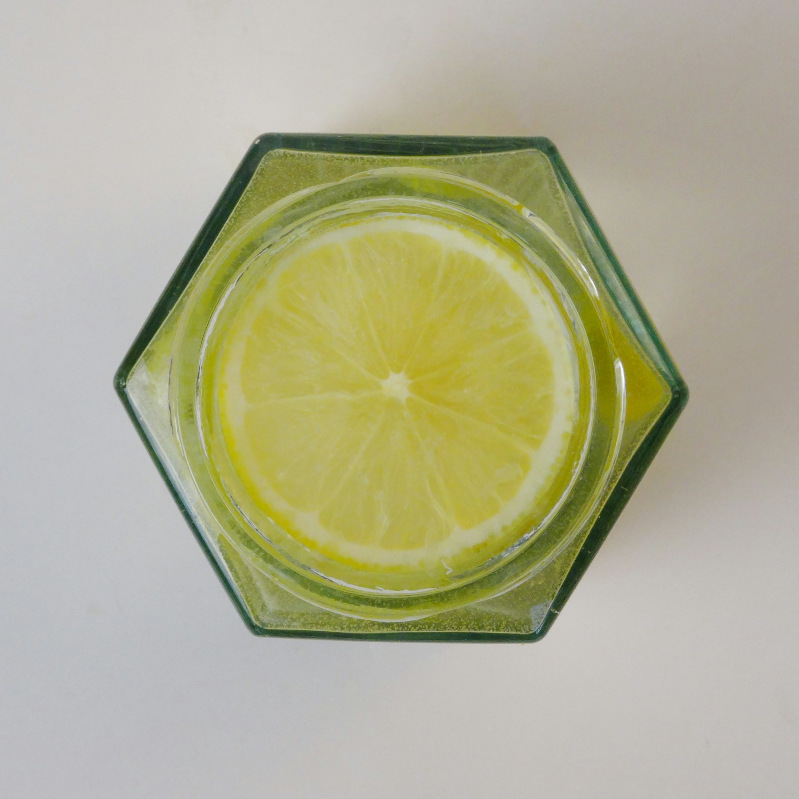 Lemon water in a geometric glass